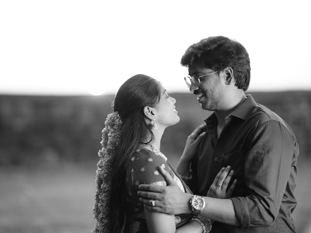 Black and white portrait of Srinu and Sai looking at each other