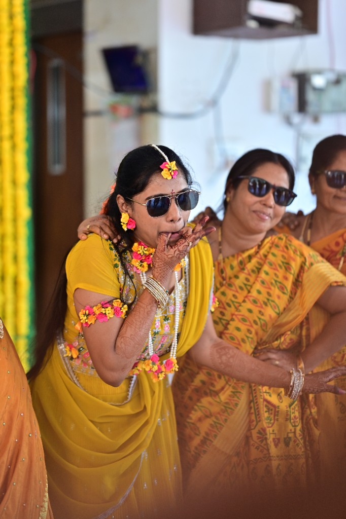 Bride wearing sunglasses, whistling for the beat